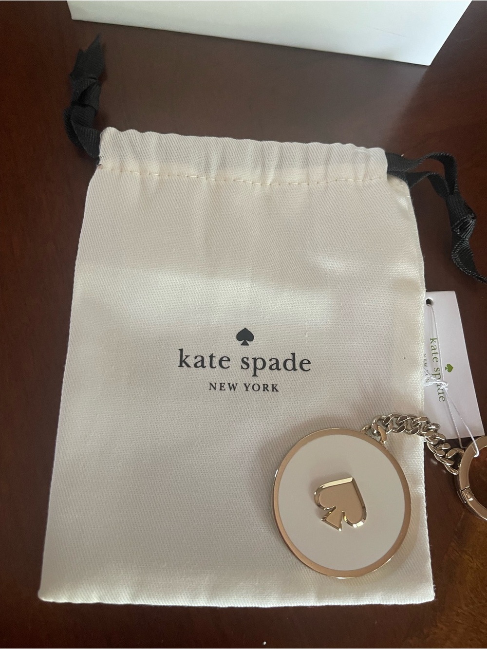 kate spade white and gold enamel spade keyring